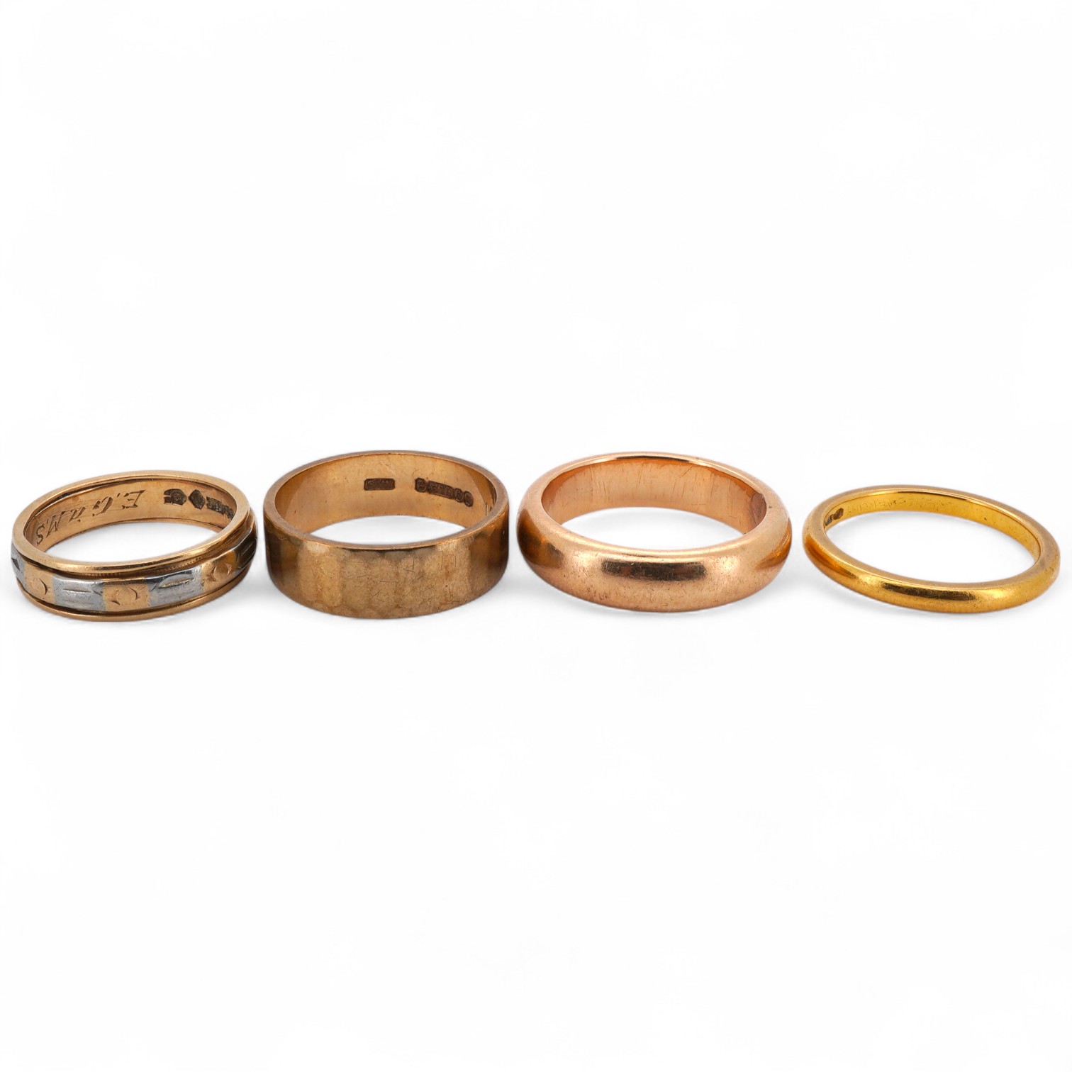 Four gold rings, comprising: a 22ct gold wedding band, size M, British assay marks, gross weight 3 grams; a 9ct gold band with a panelled finish, size N, British hallmarks, gross weight approximately 3.5 grams; a bicolou